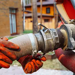 Septic pumping truck hose hookup