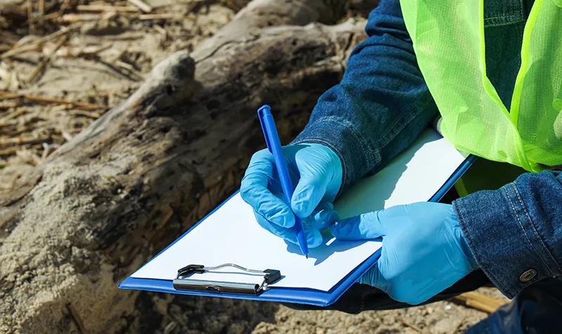 a man examines septic tank
